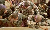 National Guard members praying