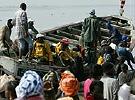 Senegalese men board a boat near Saint Louis, a popular departure point for illegal immigrants headed to the Canary Islands.